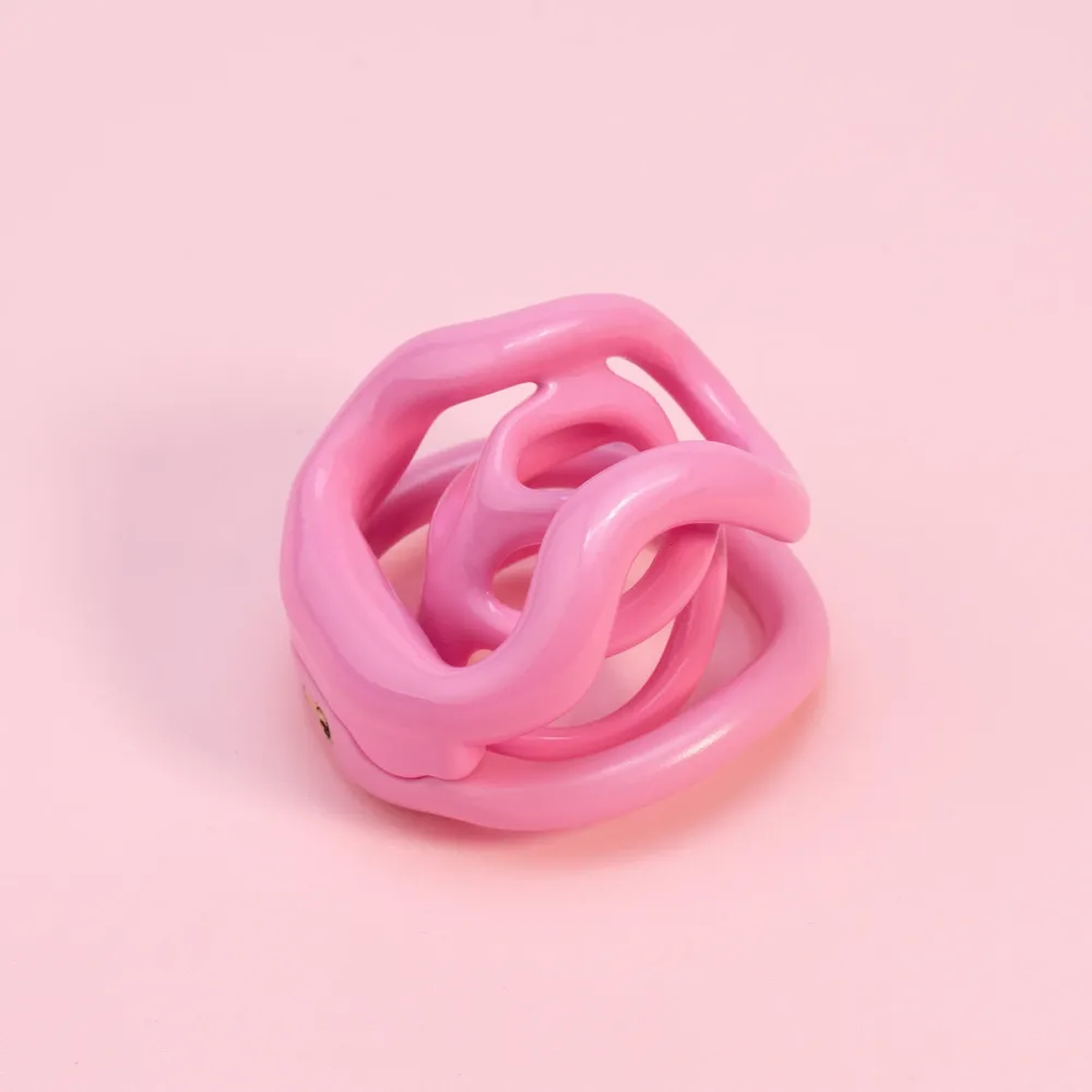 Micro gaiola de castidade restritiva rosa com hastes curvas entrelaçadas